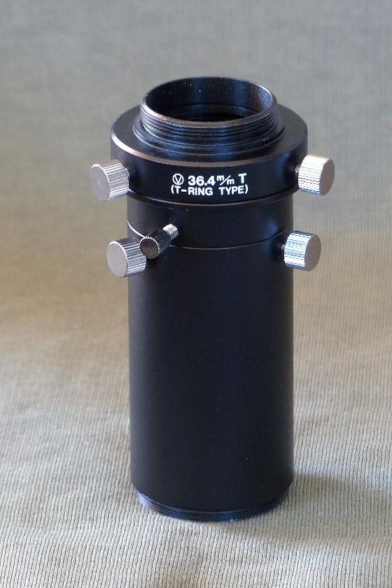 Deux oculaires, redresseur terrestre et adaptateur photo